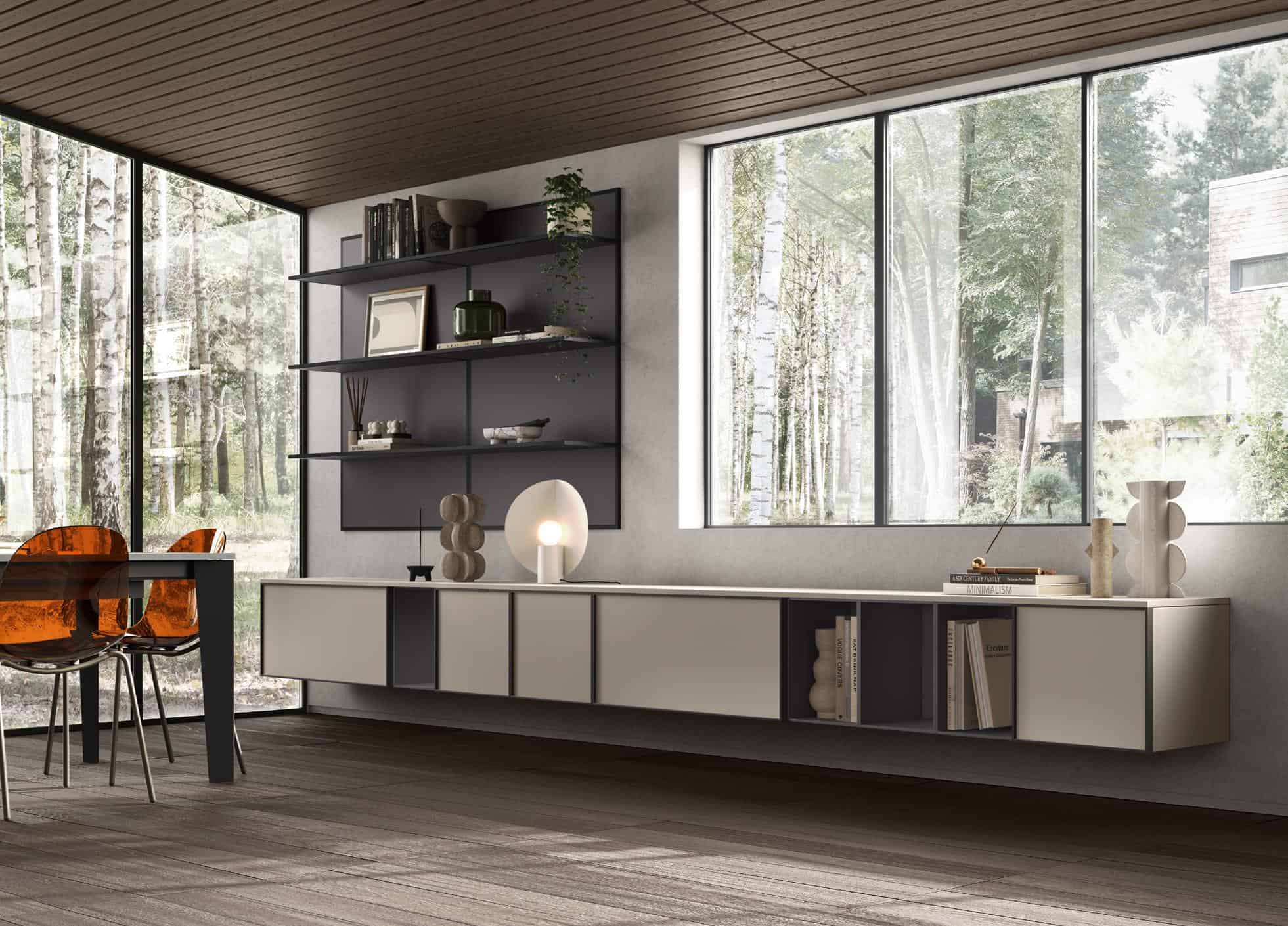 Modern interior with minimalist shelving, a cream-colored console, and a glass table with amber chairs beside large windows overlooking a forest scene.