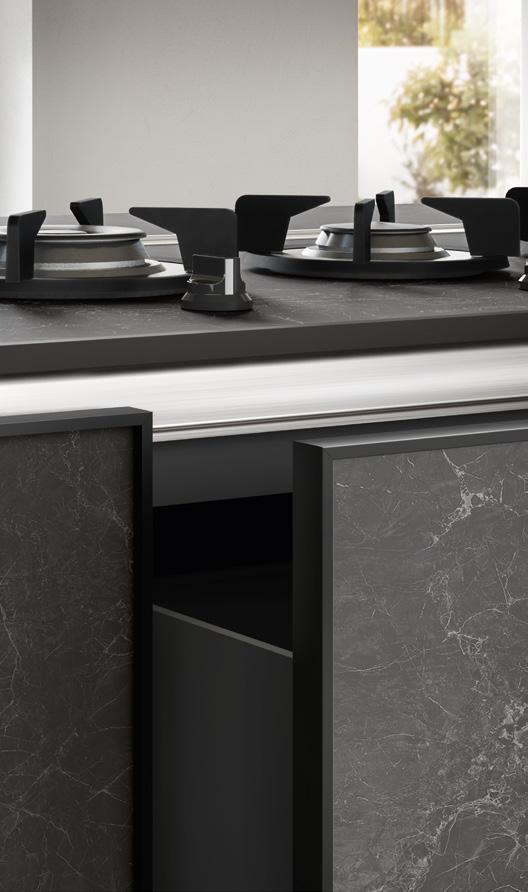 Close-up of a modern kitchen gas stove with sleek black marble cabinetry and two visible burners on the countertop.