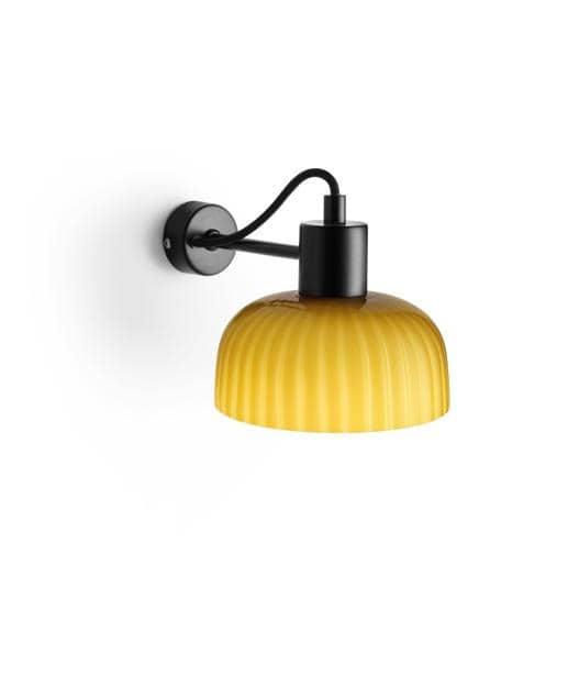 A yellow ribbed wall sconce lamp with a black metal fixture.