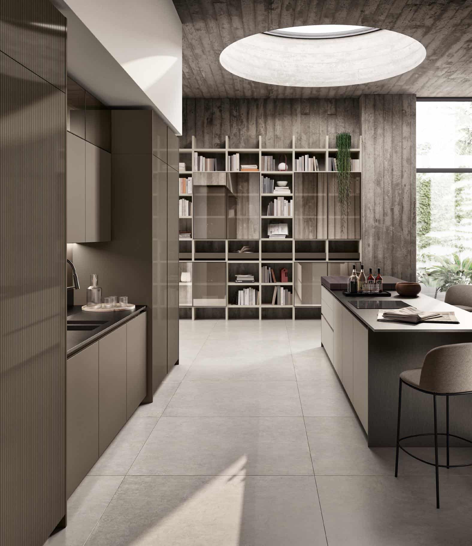 Modern kitchen and dining area with minimalist design, featuring a skylight, gray cabinets, an island with high chairs, and a wall of bookshelves.
