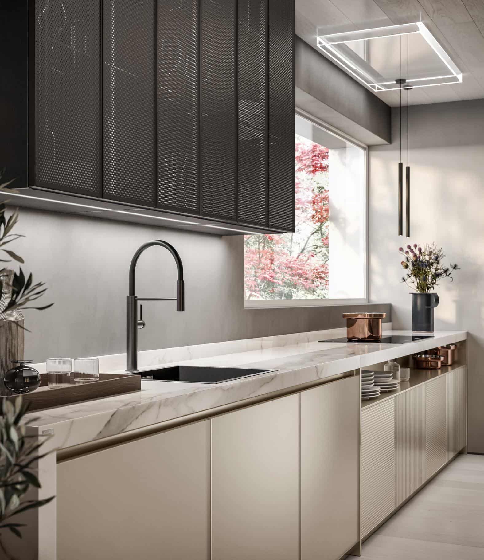 Modern kitchen interior with marble countertops, minimalist black faucet, overhead cabinets with metal mesh, pendant lighting, and a large window.