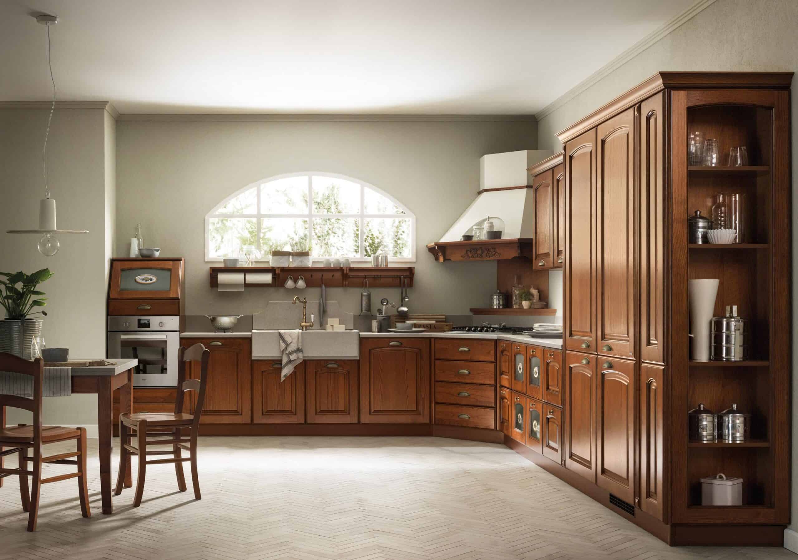 Traditional kitchen with dark wooden cabinets, a farmhouse sink, and a dining table set against a light-colored wall and large window.