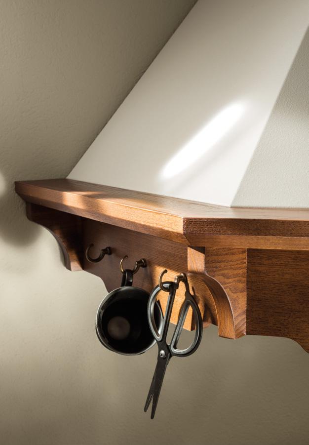 Wooden shelf with hooks; scissors and a black mug hanging from them.