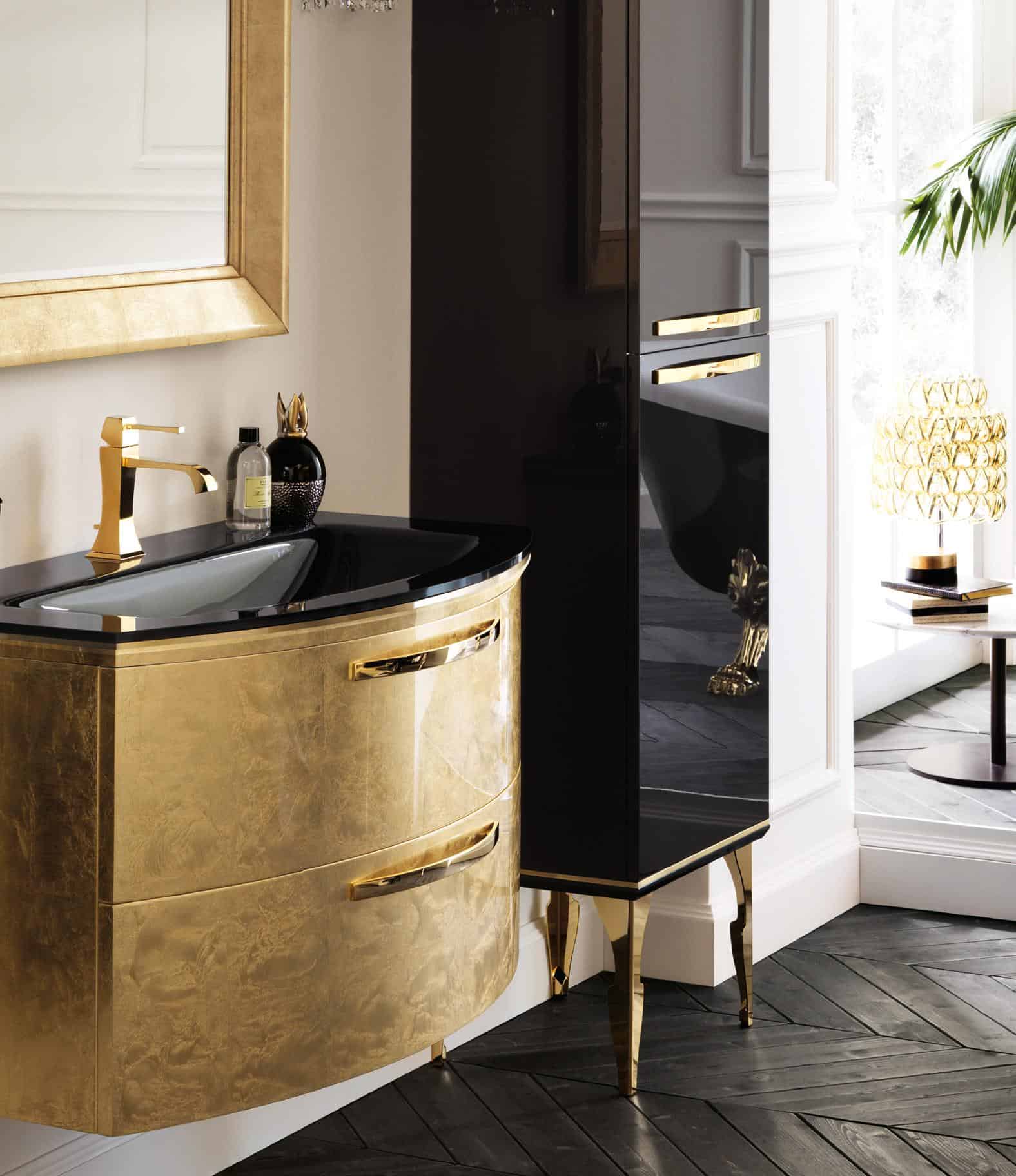 Luxury bathroom with a golden vanity, black countertop, and gold faucet, featuring elegant cabinetry and decorative items.
