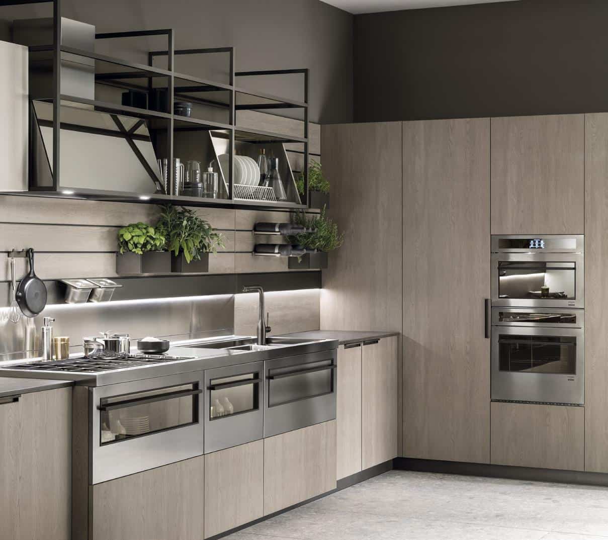 Modern kitchen with sleek cabinetry, stainless steel appliances, open shelving, and potted herbs on the wall.