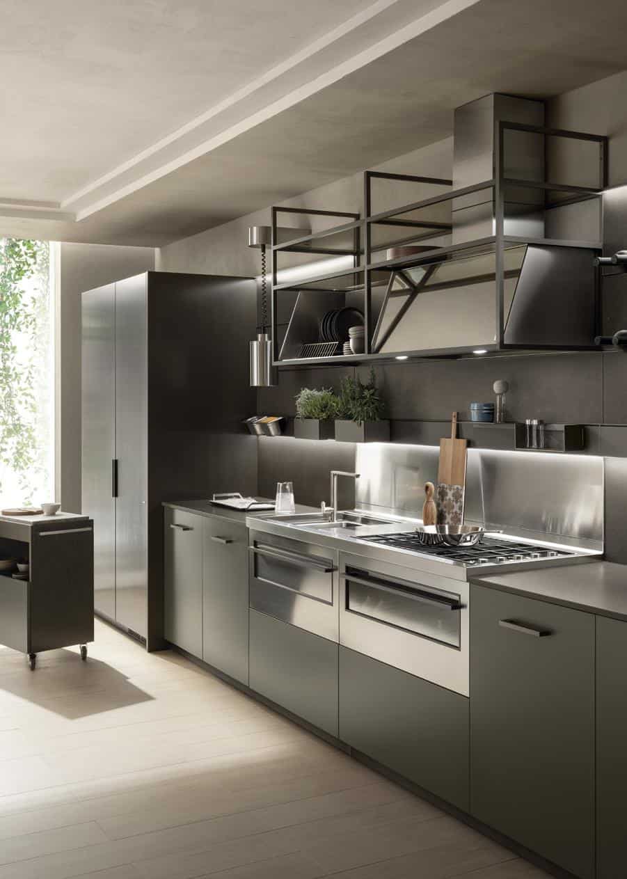 Modern kitchen with stainless steel appliances, minimalist cabinetry, a sleek countertop, and open shelving above.