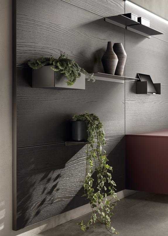 Modern wall shelves with decorative vases and potted plants against textured dark wood panels.