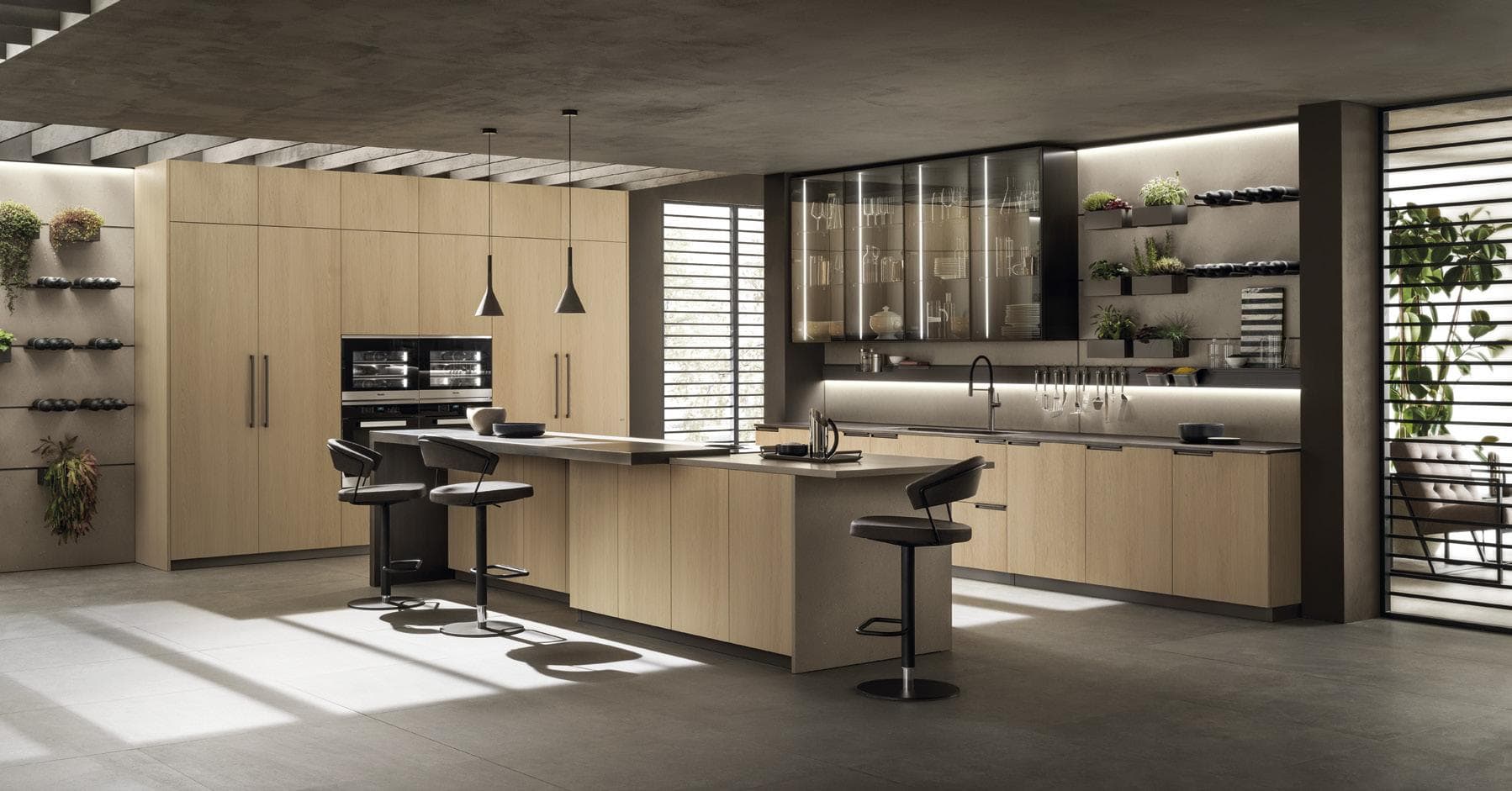 Modern kitchen with wooden cabinets, an island with bar stools, pendant lights, and open shelves displaying plants and dishes.