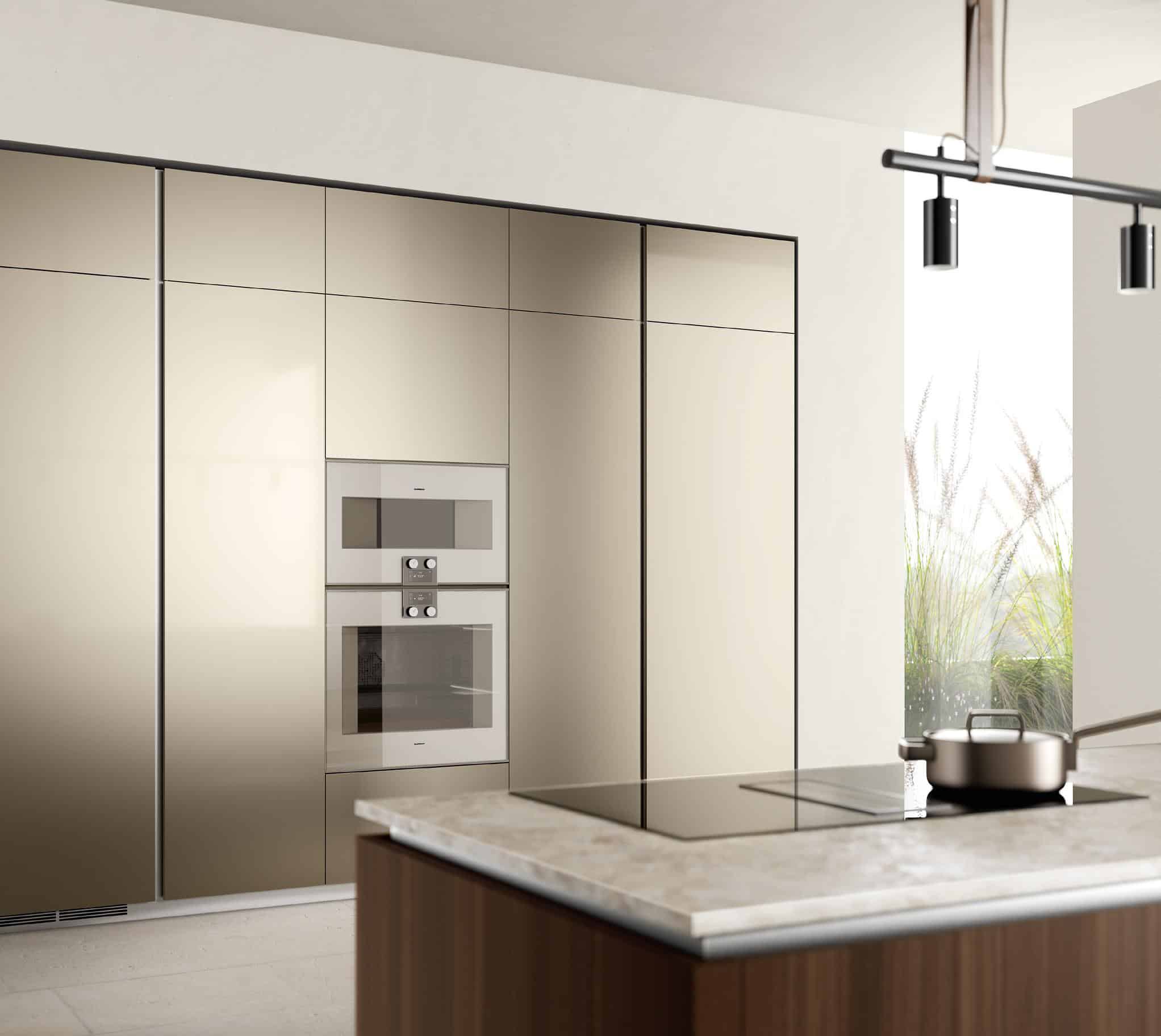Modern kitchen interior with sleek built-in appliances, beige cabinetry, and a marble countertop island with an induction stove and a pot.