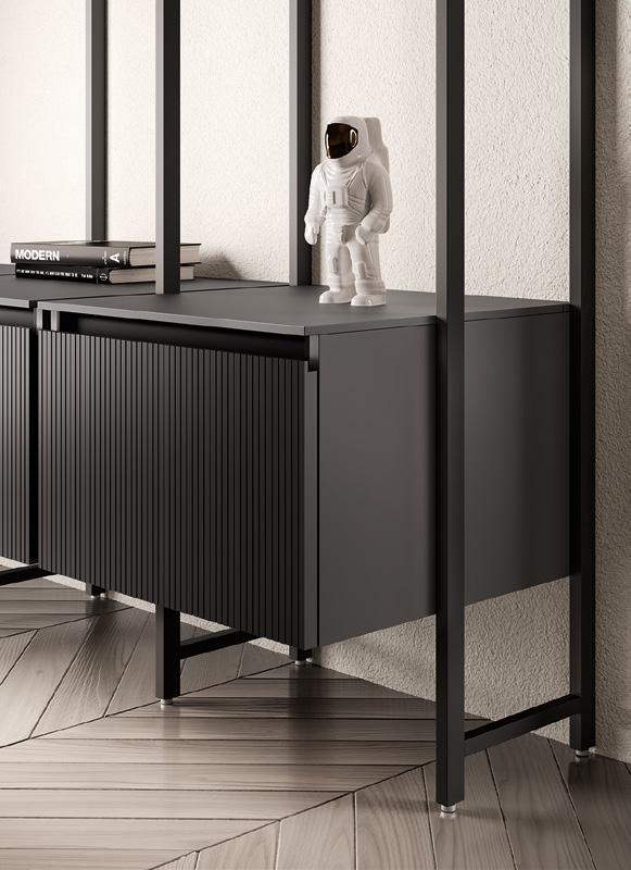 A small astronaut figurine stands on a modern dark cabinet next to two stacked books titled &quot;Modern.&quot;
