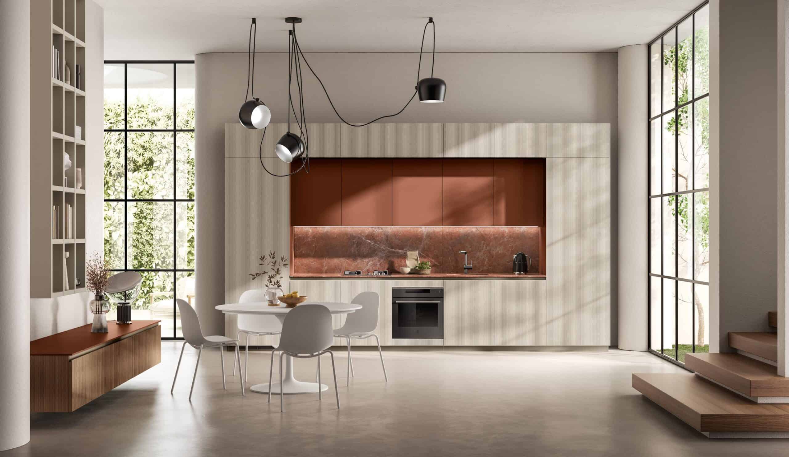 Modern kitchen with beige cabinets, red marble backsplash, a round dining table with white chairs, and large windows allowing natural light in.