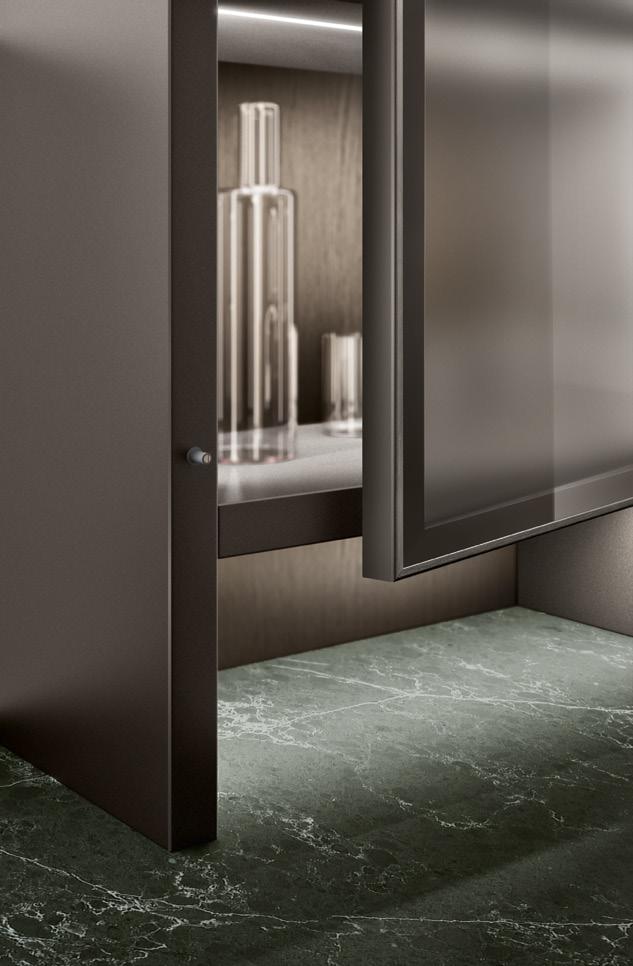 Open cabinet door revealing glass bottles inside, with a green marble floor beneath.