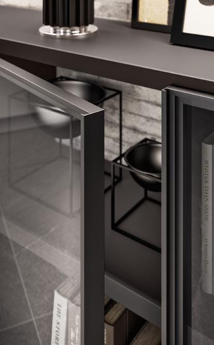 Glass cabinet doors slightly open, revealing interior with metal-framed decorative bowls and neatly arranged books on shelves.