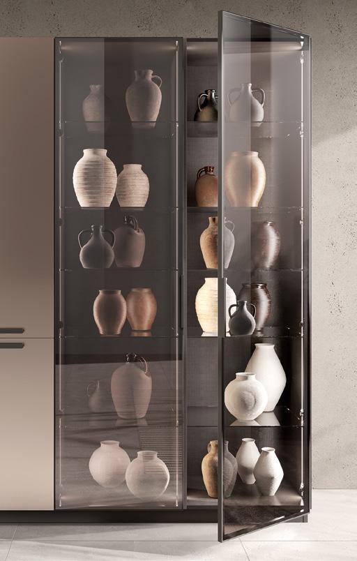 A glass cabinet filled with various ceramic vases in neutral tones.