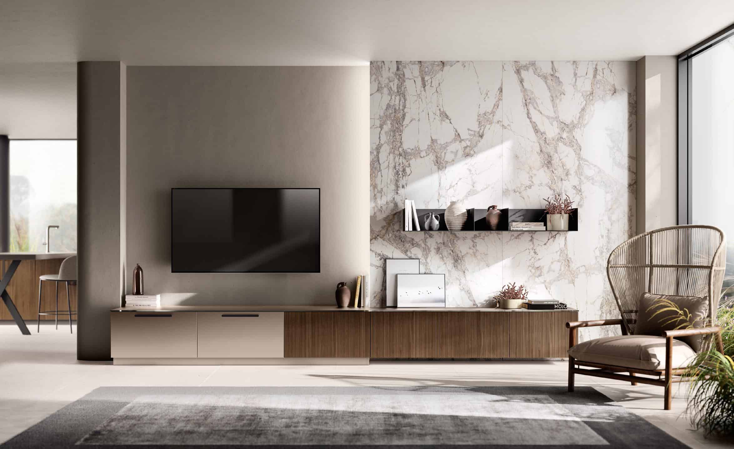 Modern living room with a wall-mounted flat-screen TV, marble accent wall, minimalist furniture including a low cabinet, wicker chair, and decorative items, with large windows providing natural light.