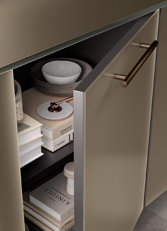 Open kitchen cabinet with stacked books, a bowl, and tableware on a shelf.