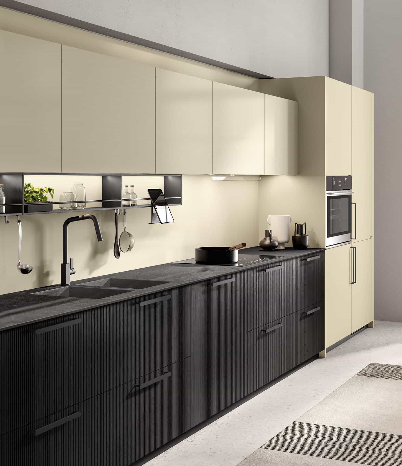 Modern kitchen with beige upper cabinets, black lower cabinets, a black faucet, and a built-in oven.