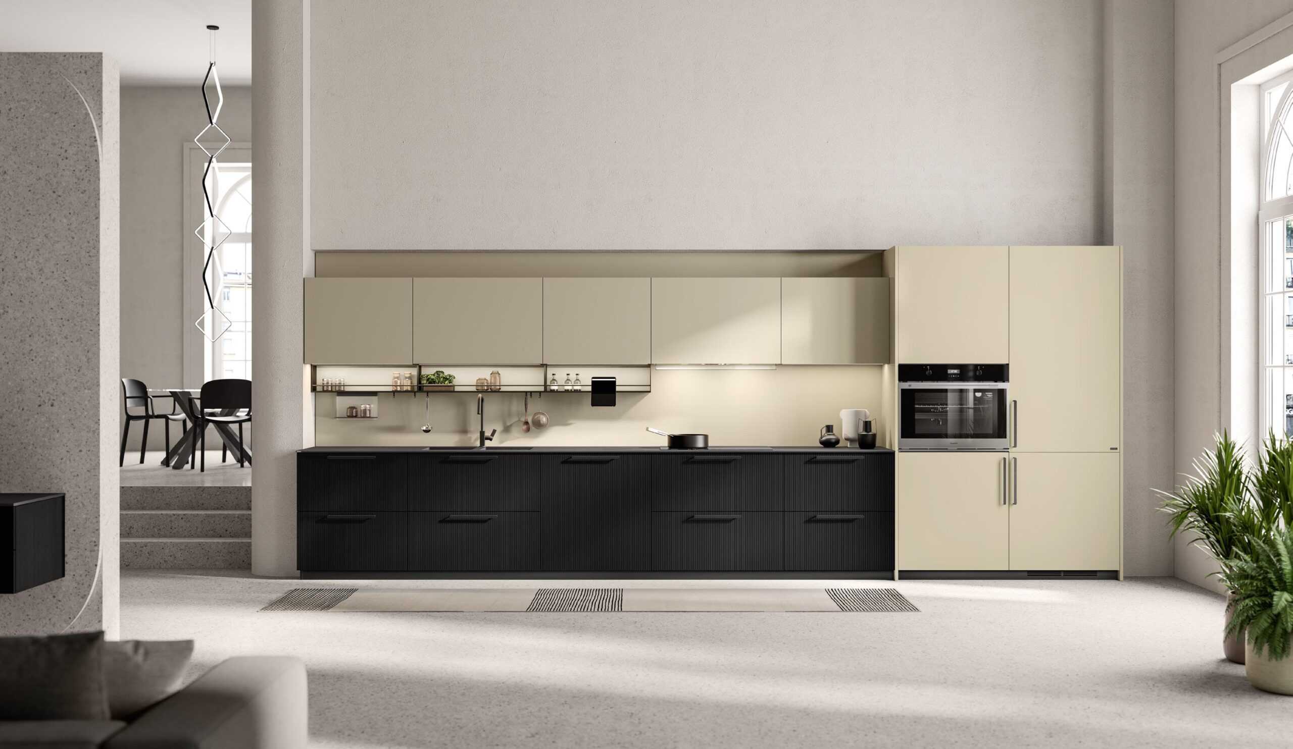 Modern kitchen interior with beige cabinetry, black lower cabinets, and built-in appliances, adjacent to a dining area with a table and chairs in the background.