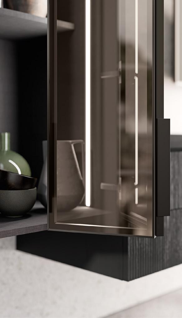 Glass cabinet door with a sleek, modern design partially open, revealing shelves with ceramic bowls and vases inside.