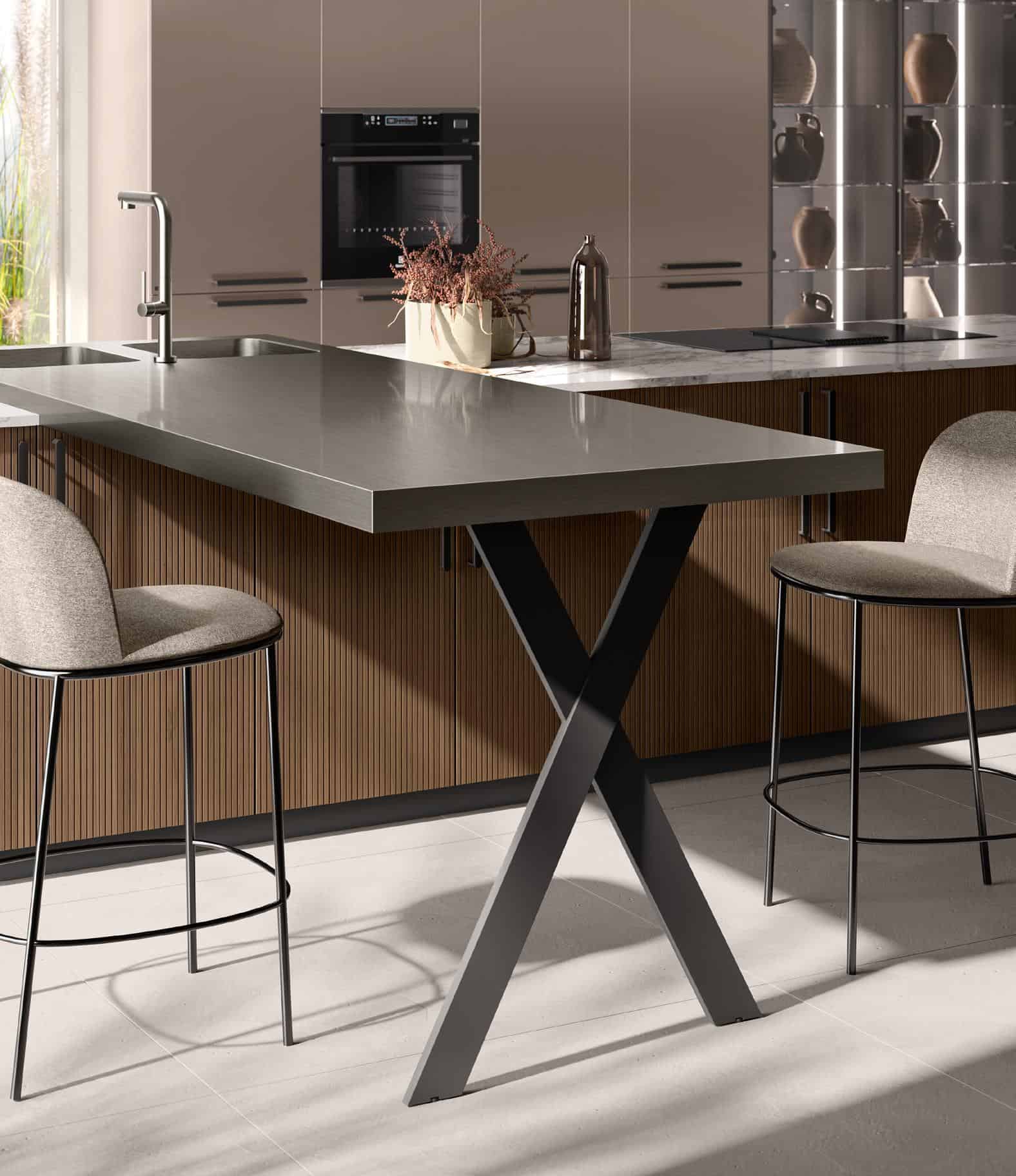 Modern kitchen with a sleek metal countertop, two bar stools, integrated oven, and decorative vases on open shelves.