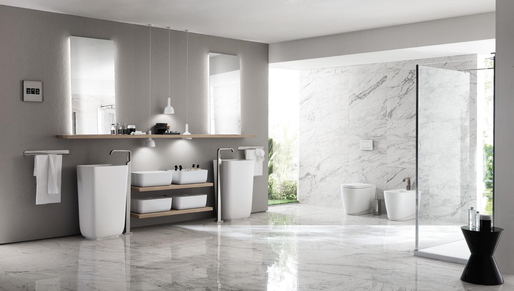 Modern bathroom with freestanding sinks, marble floors, and a large glass shower enclosure.