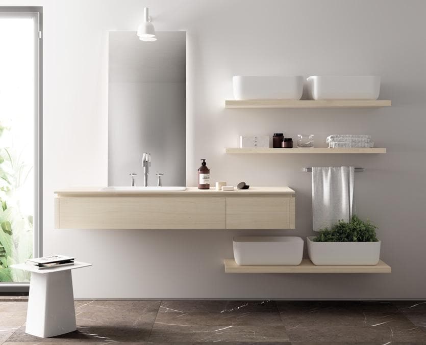 Modern bathroom with a floating wooden vanity, large mirror, wall-mounted shelves with containers, and a towel holder.