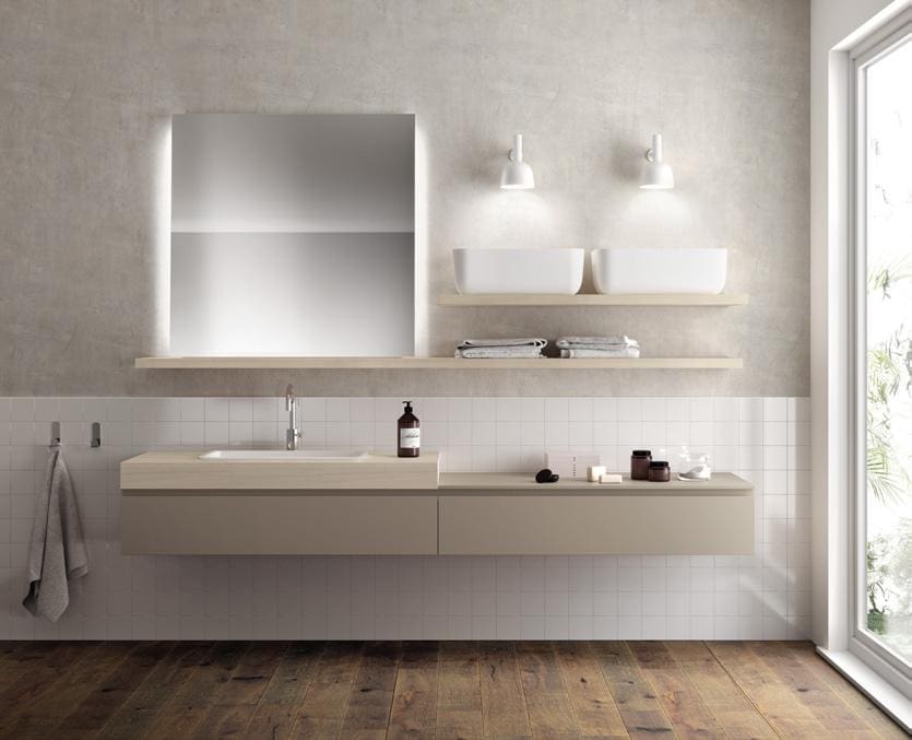 Modern bathroom with a floating vanity, backlit mirror, dual sinks on a wooden shelf, and wooden flooring.
