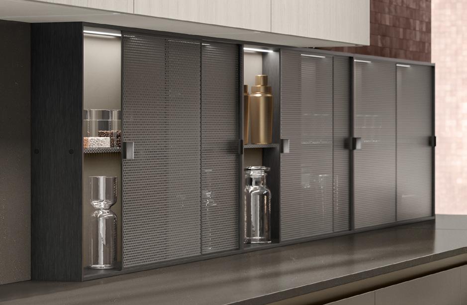 Glass-fronted kitchen cabinets with sliding doors, displaying glass jars and containers.