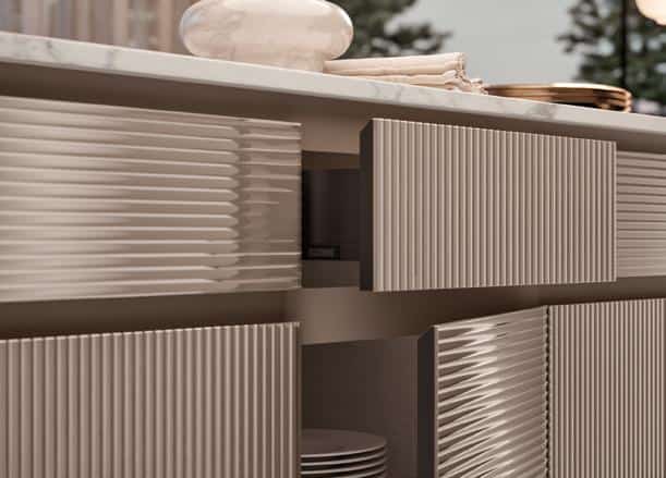 Textured cabinet doors with vertical ridges below a marble countertop.