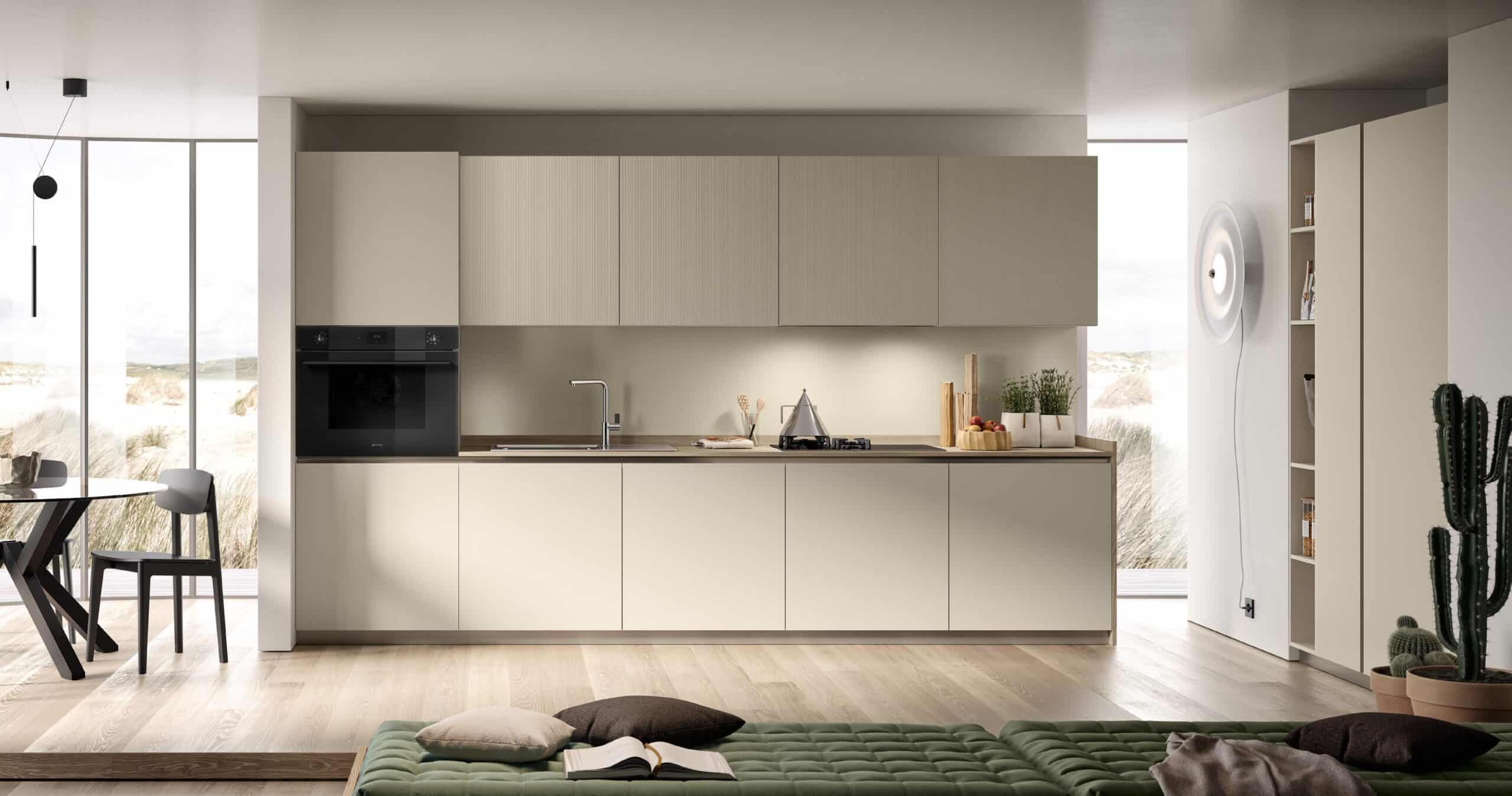 Modern kitchen with light cabinetry, built-in oven, countertop with sink and stove, a dining table with chairs, wooden flooring, and a large window.