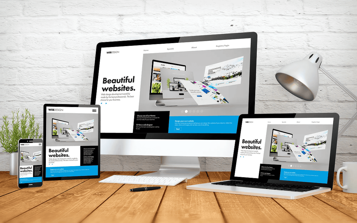 A responsive website appearing on a monitor, a laptop screen, a tablet, and a smart phone.