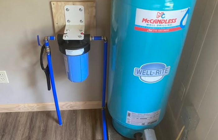 A Well-Rite pressure tank and water filter system installed by McCandless Well Drilling and Services Inc, ready to provide clean water.