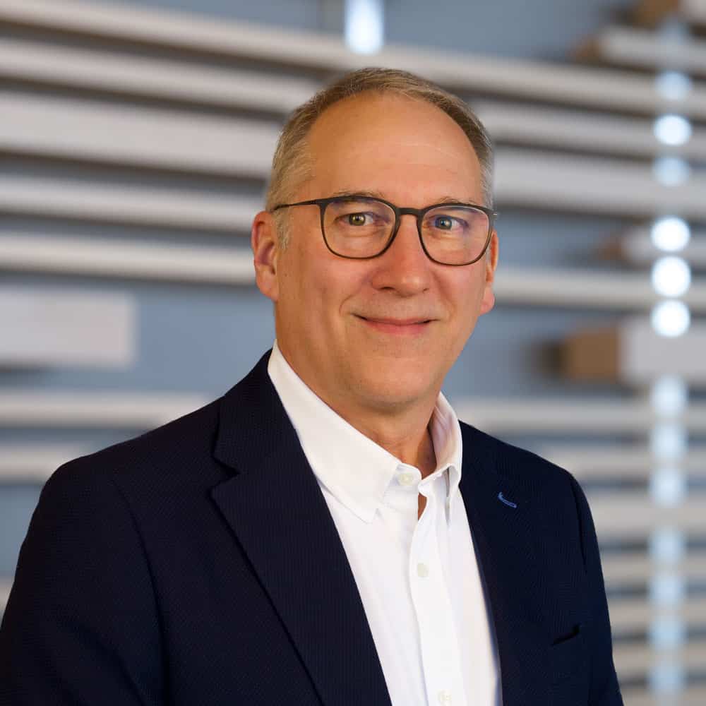 A businessman in glasses