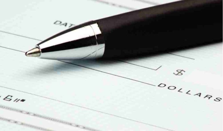 blank check with a pen