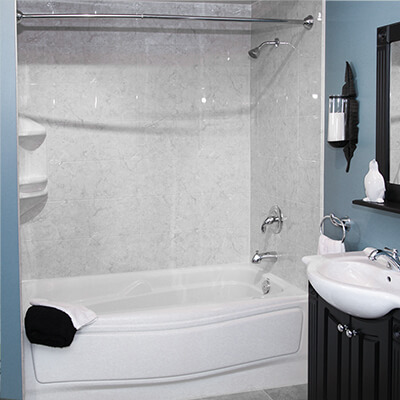A sparkling, modern bathroom by Mid State Baths shows how a new tub and shower can make your space look fresh and relaxing.