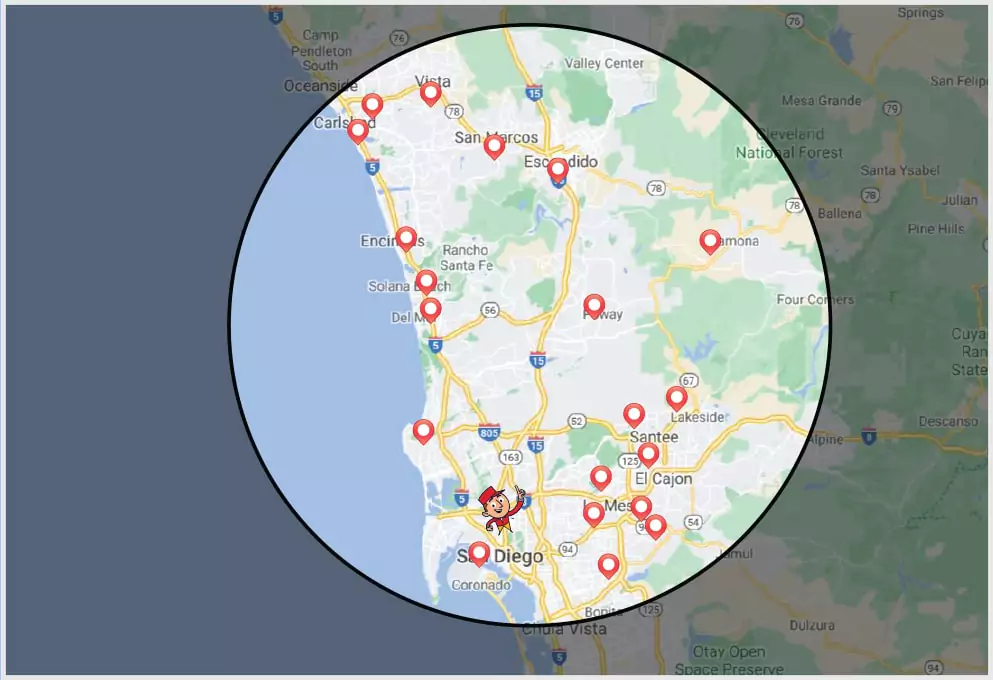 Map of San Diego County, highlighting various locations with red markers within a circular boundary. Areas include San Diego, Vista, Encinitas, and Escondido.