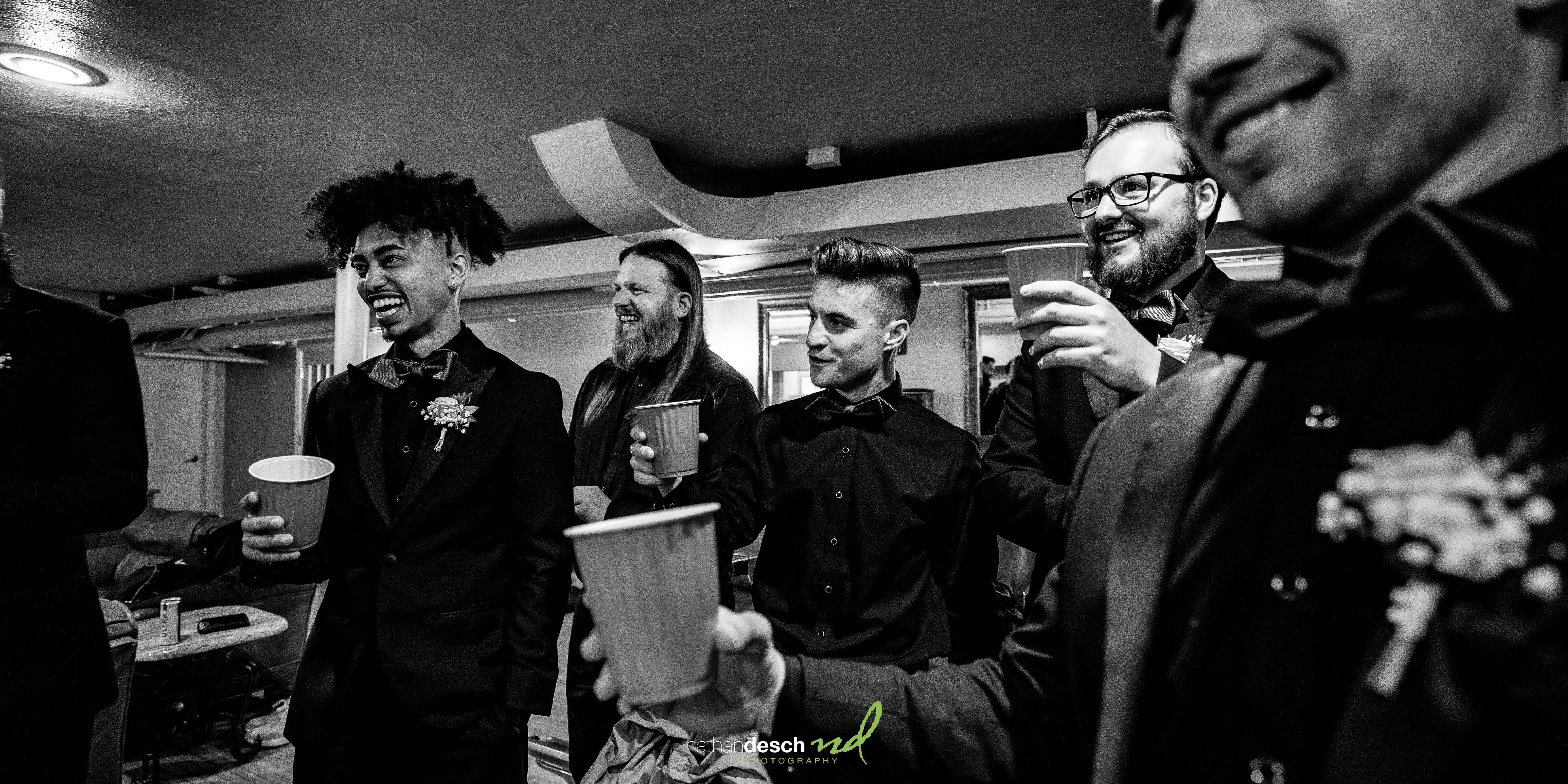 men toasting groom