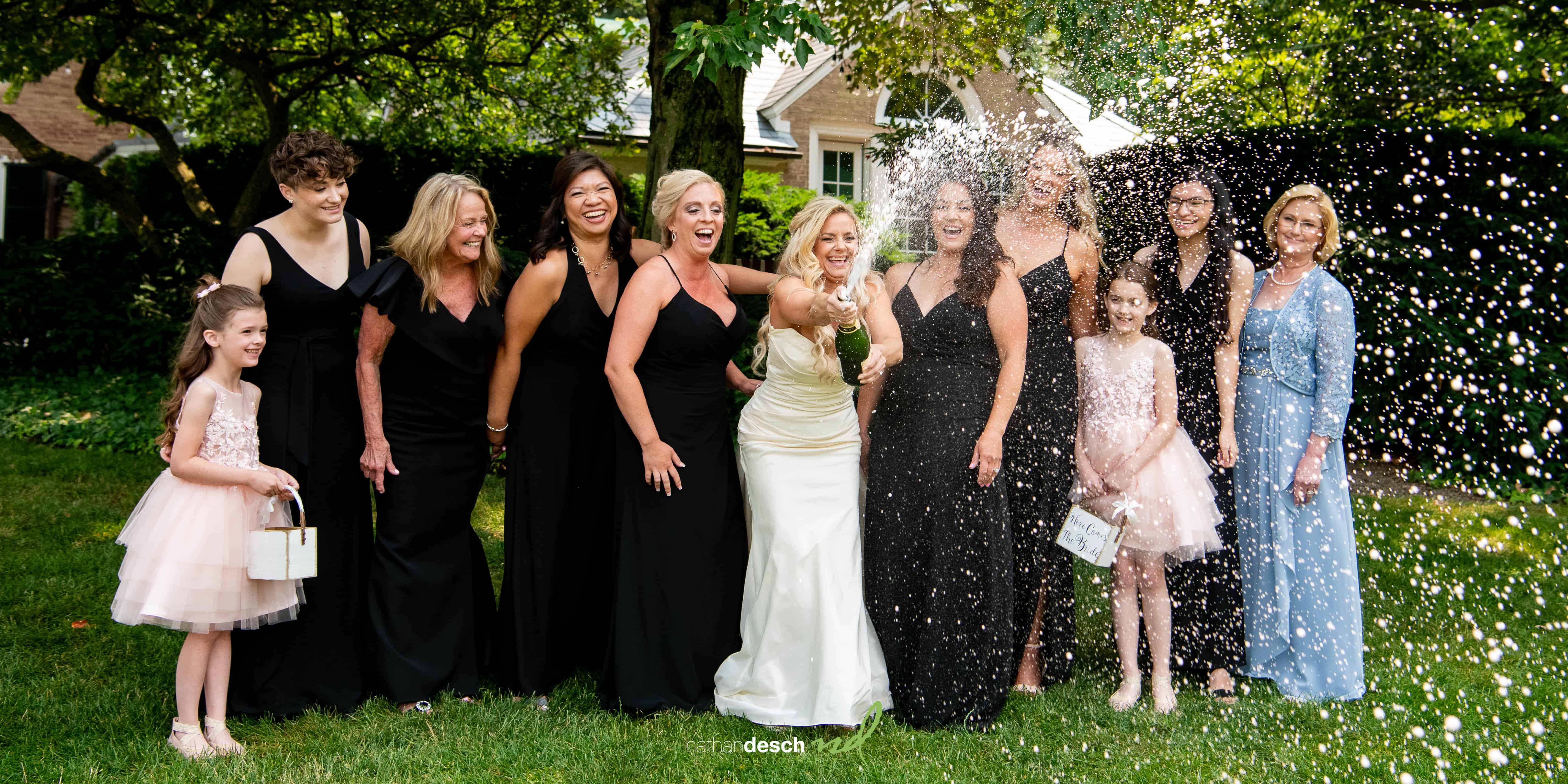 bride spraying champagne 