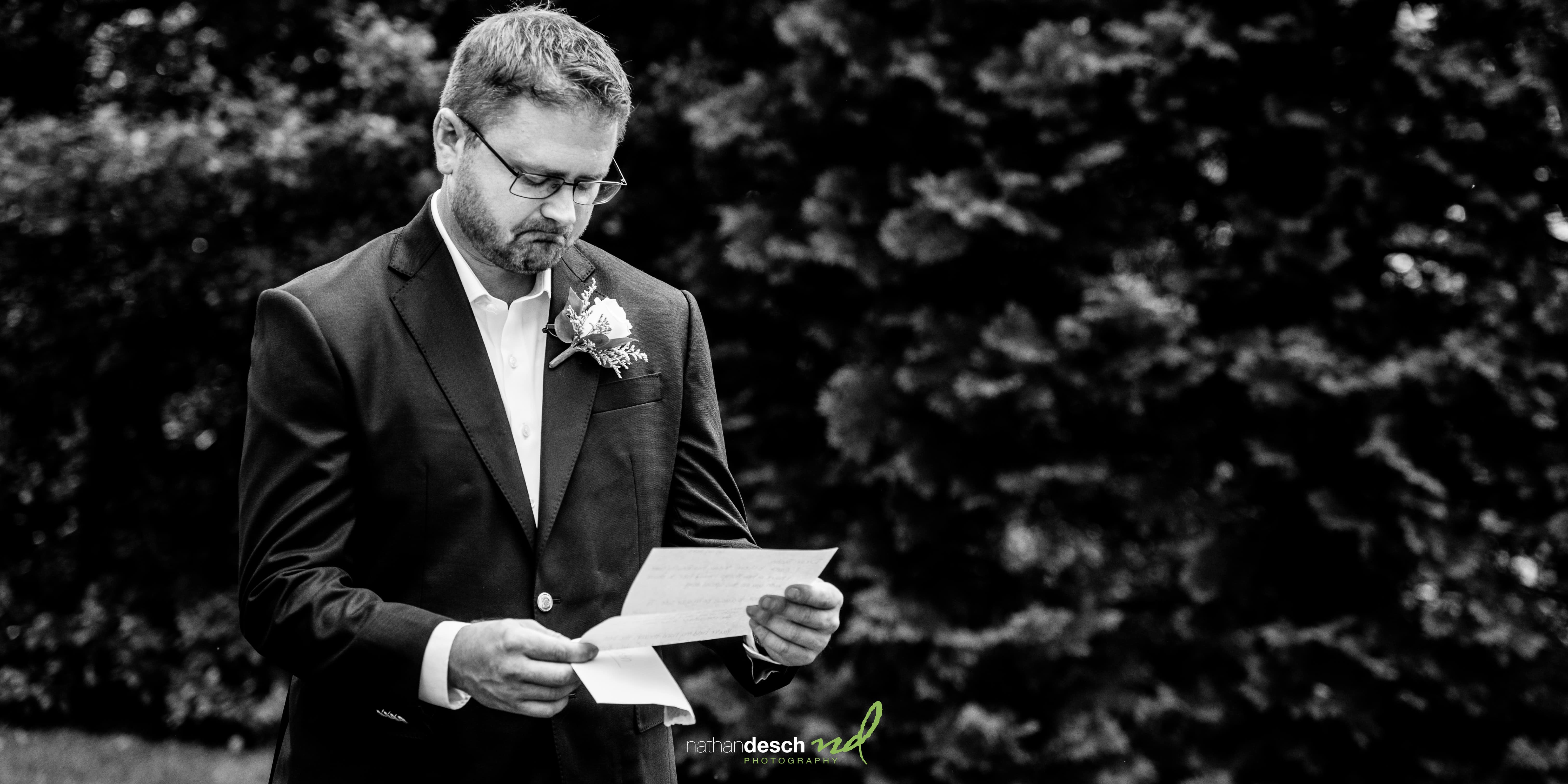 groom reading letter from bride