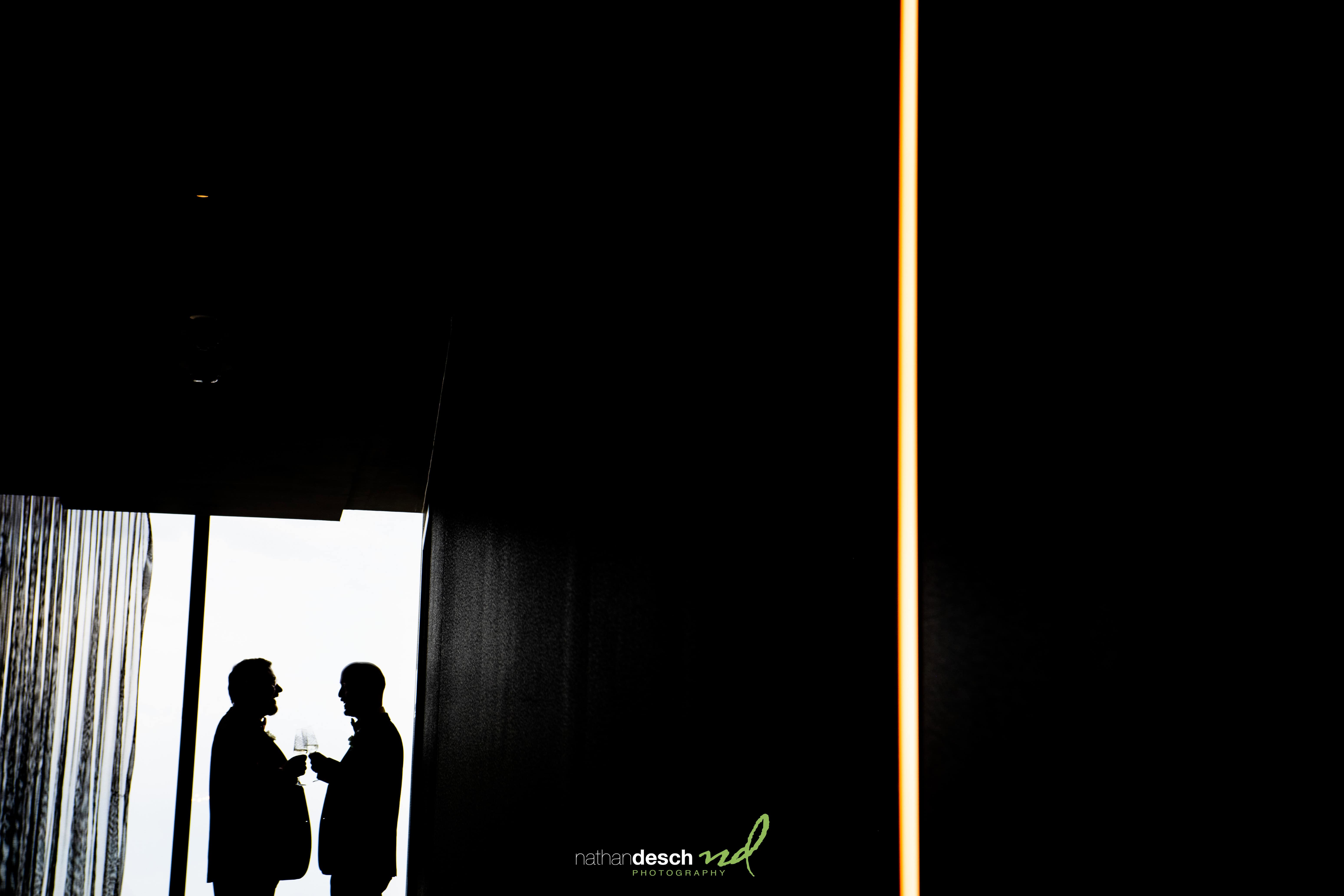 grooms enjoying a drink together