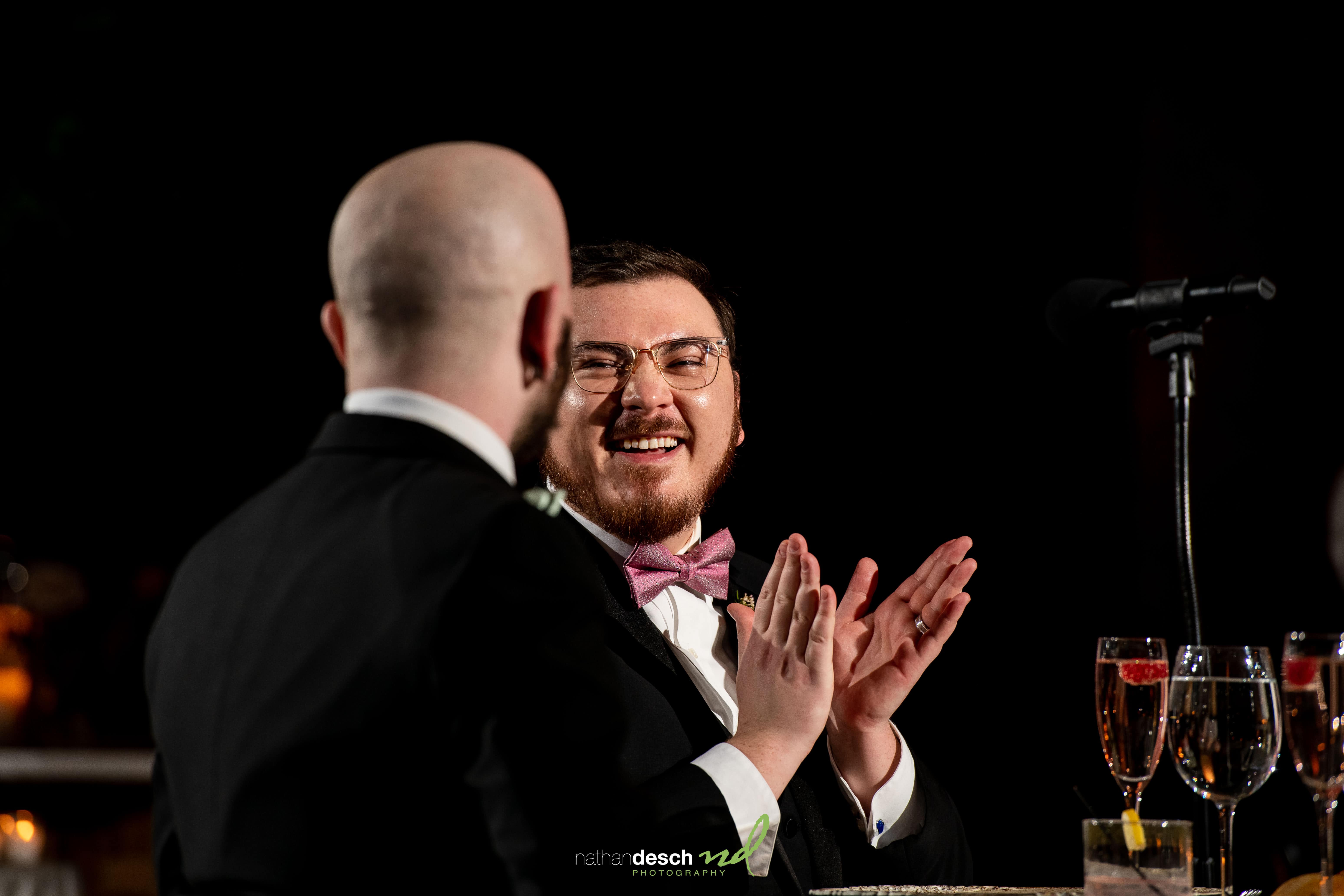 grooms enjoying toast