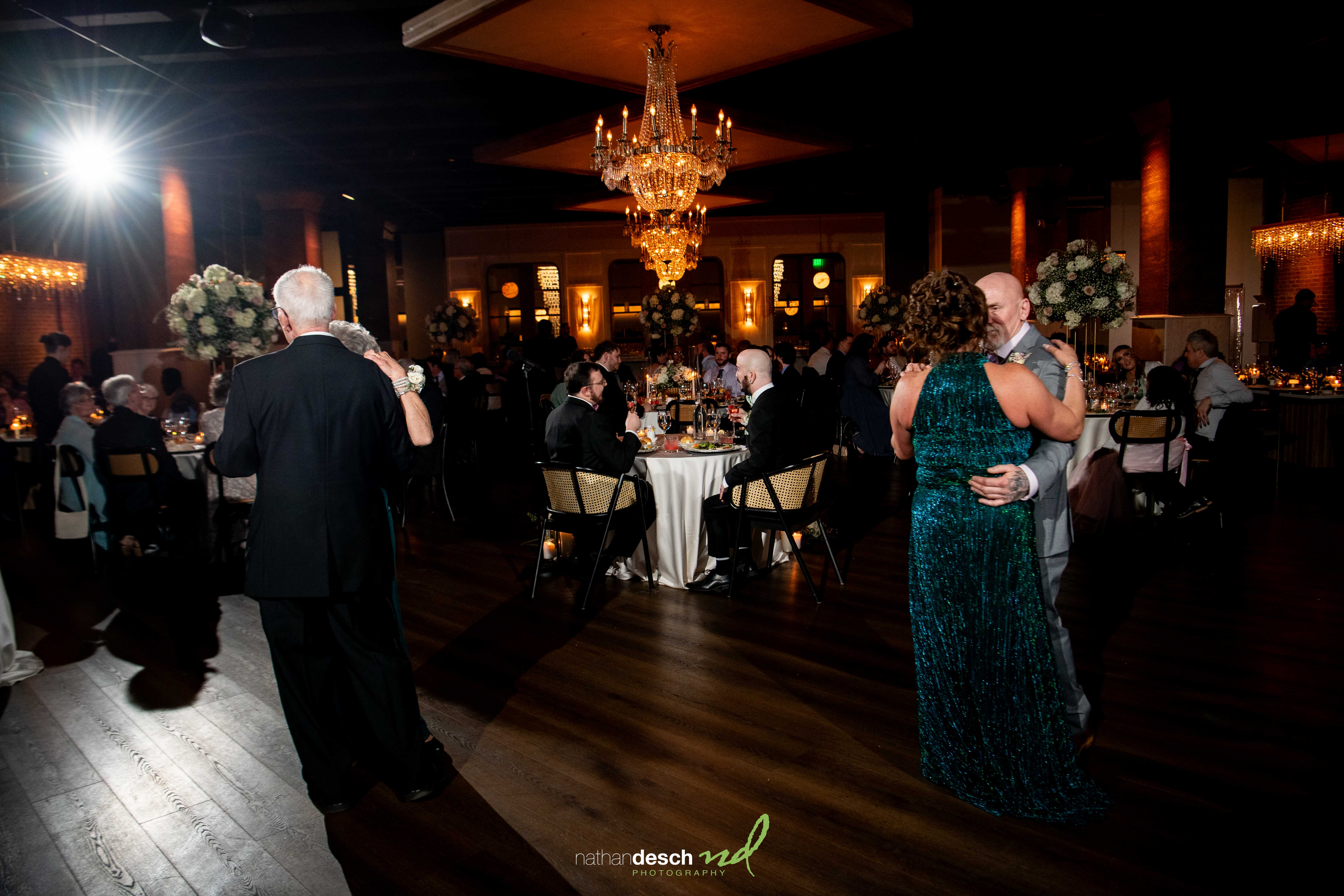 parents of grooms dancing