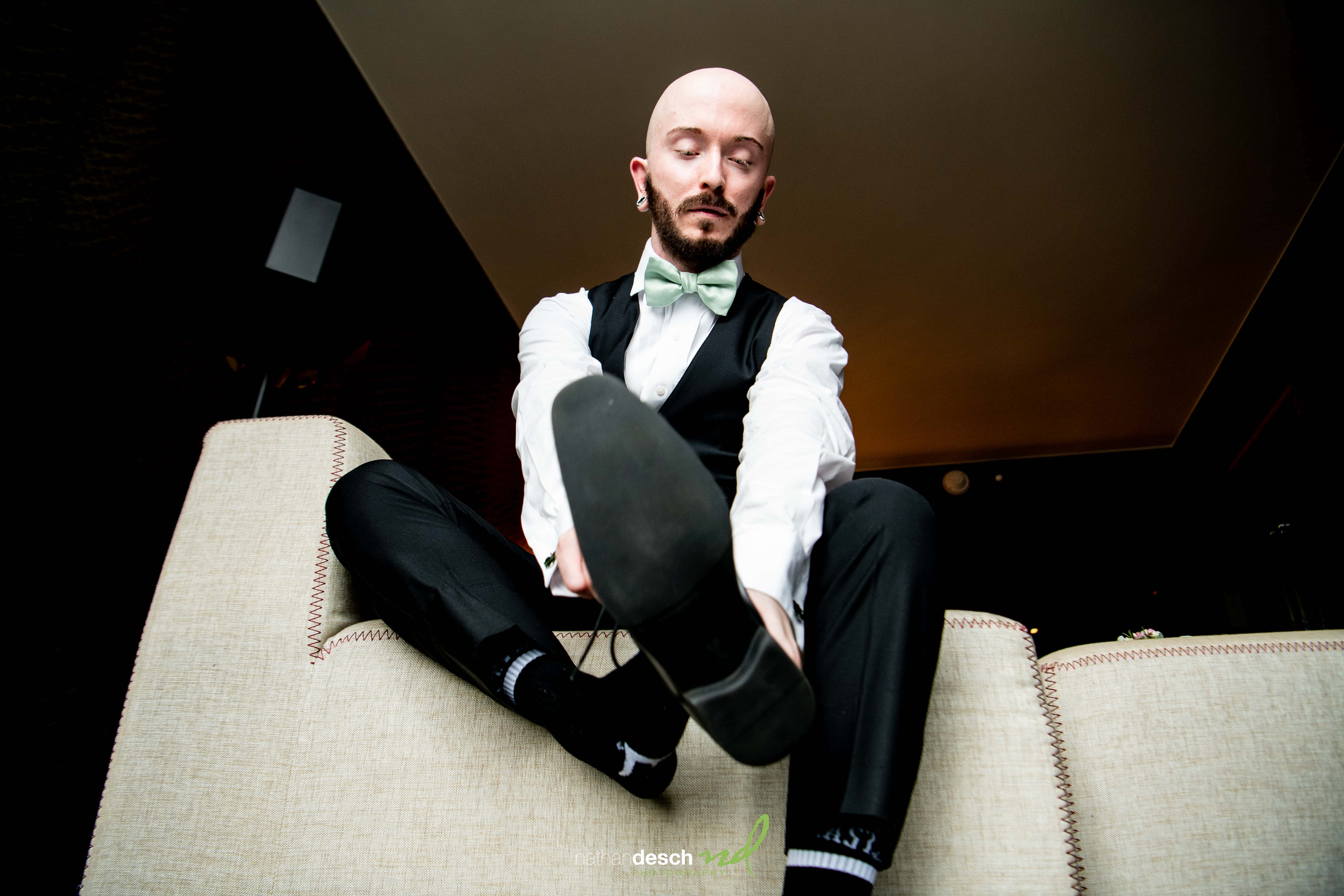 groom getting shoes on