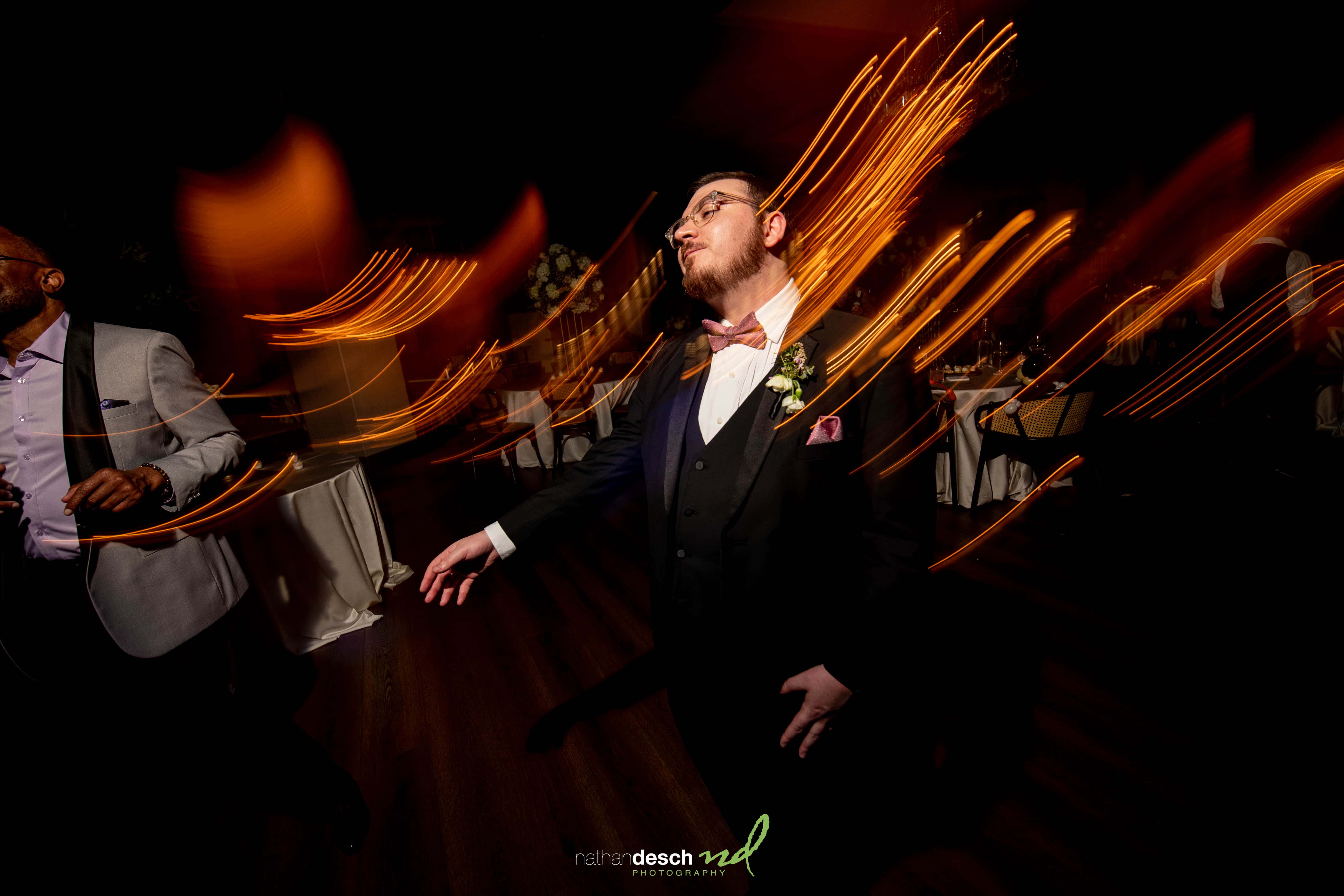 groom dancing at reception