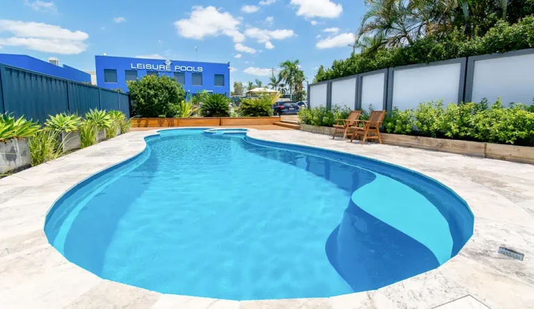 Custom fiberglass pool with a connected hot tub