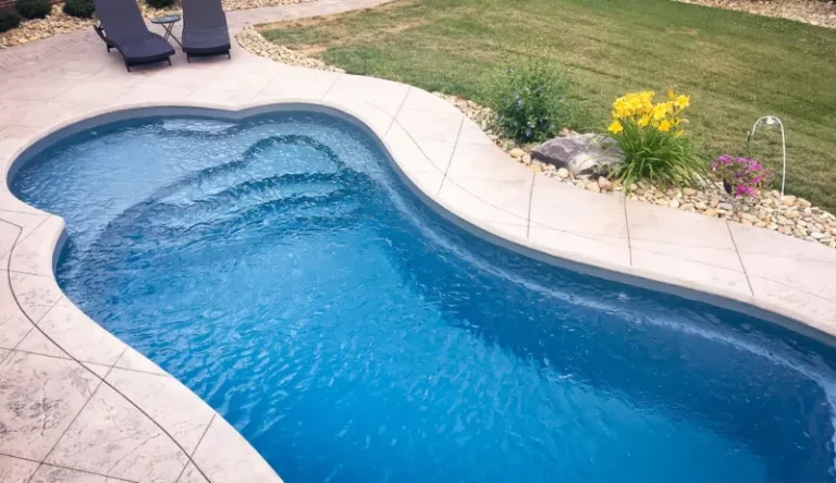 Swimming pool contractor displaying a new inground pool