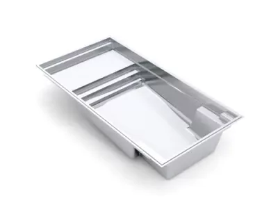 Rectangular in-ground swimming pool with steps on one end, featuring a sleek, modern design and smooth, light-colored interior surface—expertly crafted by a skilled swimming pool contractor specializing in fiberglass pools.