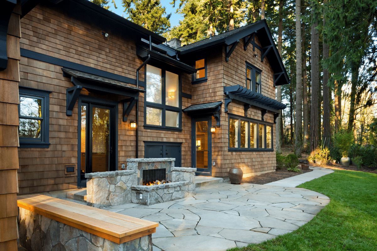 Northern Colorado Pools showcasing an outdoor fireplace with elegant design.
