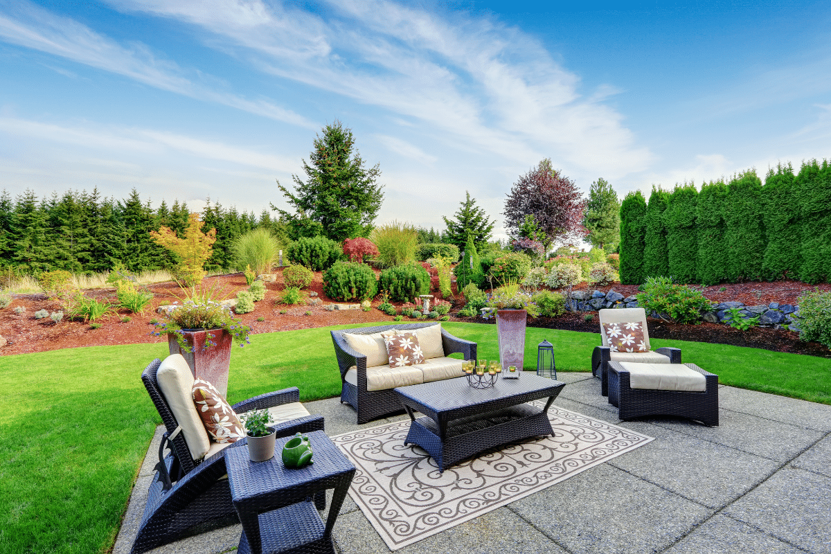 Outdoor patio featuring masonry work and modern furniture.