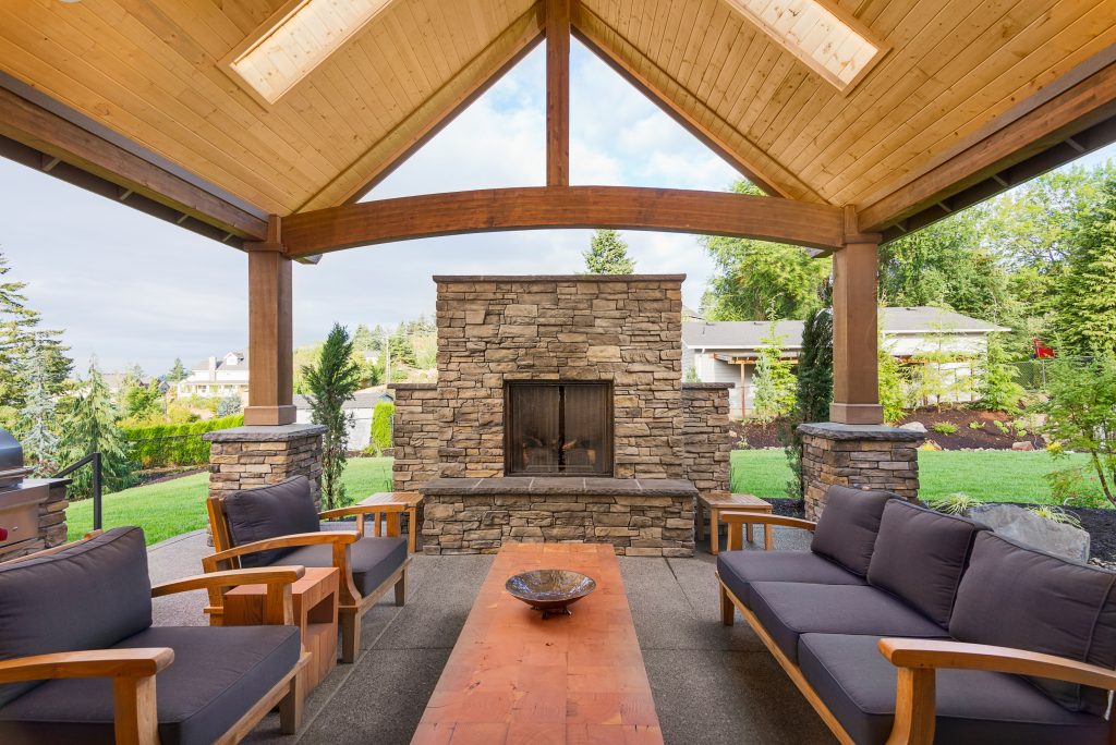 Custom-built outdoor fireplace with stone masonry.